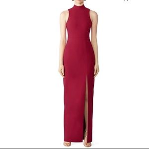 Likely red teigan gown sleeveless height neck open back burgundy dress